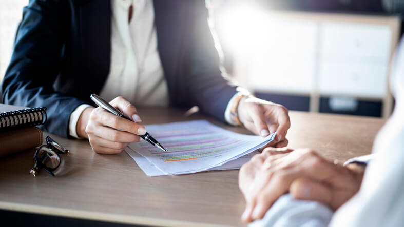 Business law attorney sitting with client