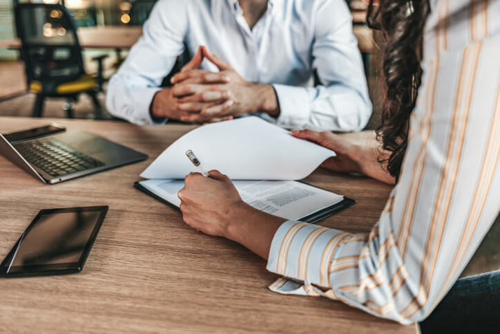 Business attorney sitting with client