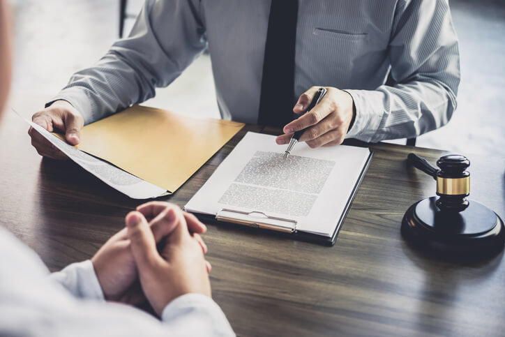 Business attorney sitting with client