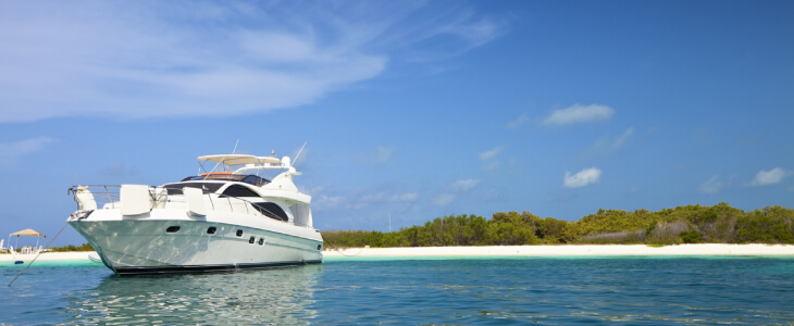 High net worth person owns yacht near topical island