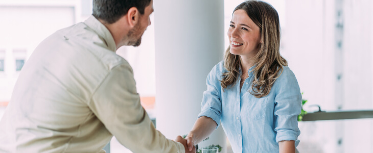 man and woman shaking hands in a verbal contract
