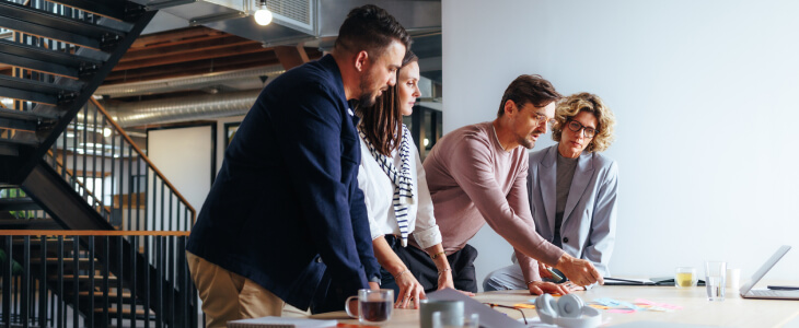 business people gathered around a desk