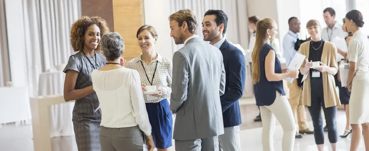 Corporate team of professionals engaging in positive conversations