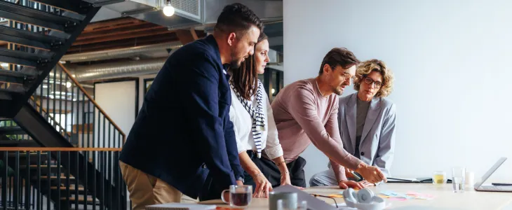 business people gathered around a desk